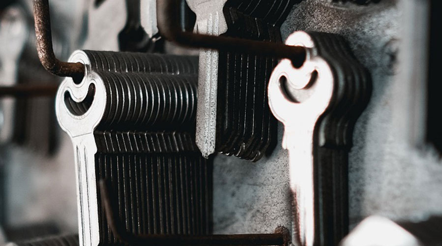 A wall of hanging keys; image used for HSBC New Zealand Live Sign page